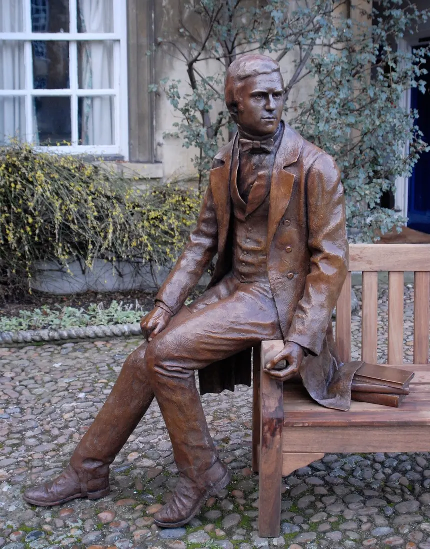 Charles Darwin — Life-sized bronze statue of the young (age 22) Charles Darwin at Christ's College, Cambridge. Sculpted by the British artist Anthony Smith. Shown here in the colle