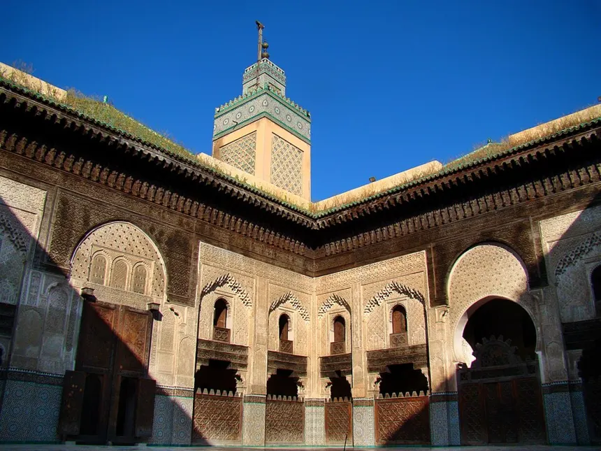 İbn Haldun — The courtyard and the minaret of Bou Inania Madrasa in Fes, Morocco. The photo was taken in the morning in late April.