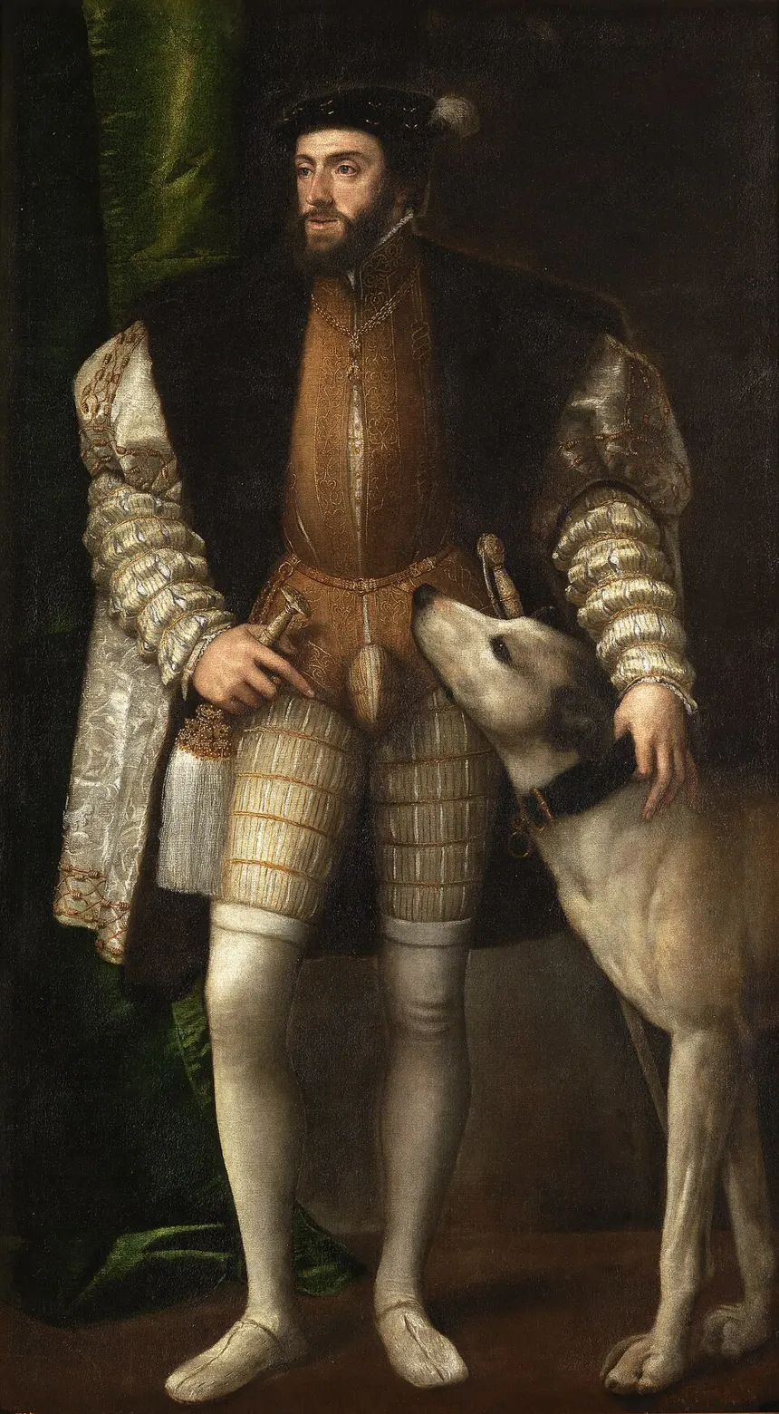 İspanyol İmparatorluğu — Retrato del emperador Carlos I de España (1500-1558), que aparece representado de cuerpo entero y junto a un perro.
